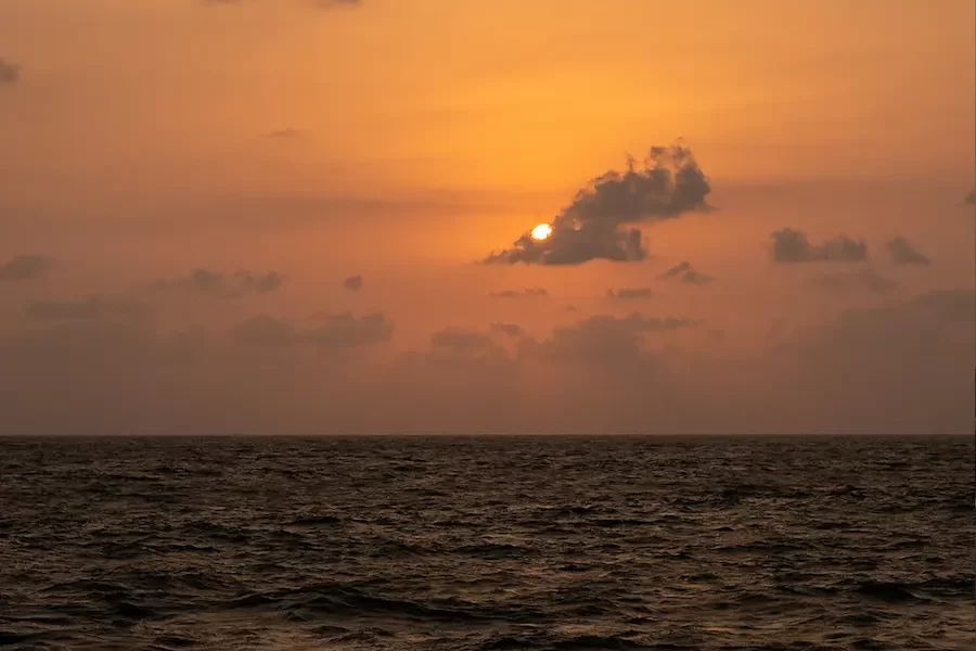 Picture of a sunset at a beach from a resort in gokarna